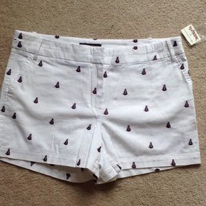 White shorts with purple sailboats
